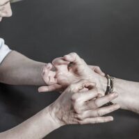 Doctor checks Patient Arm - Image